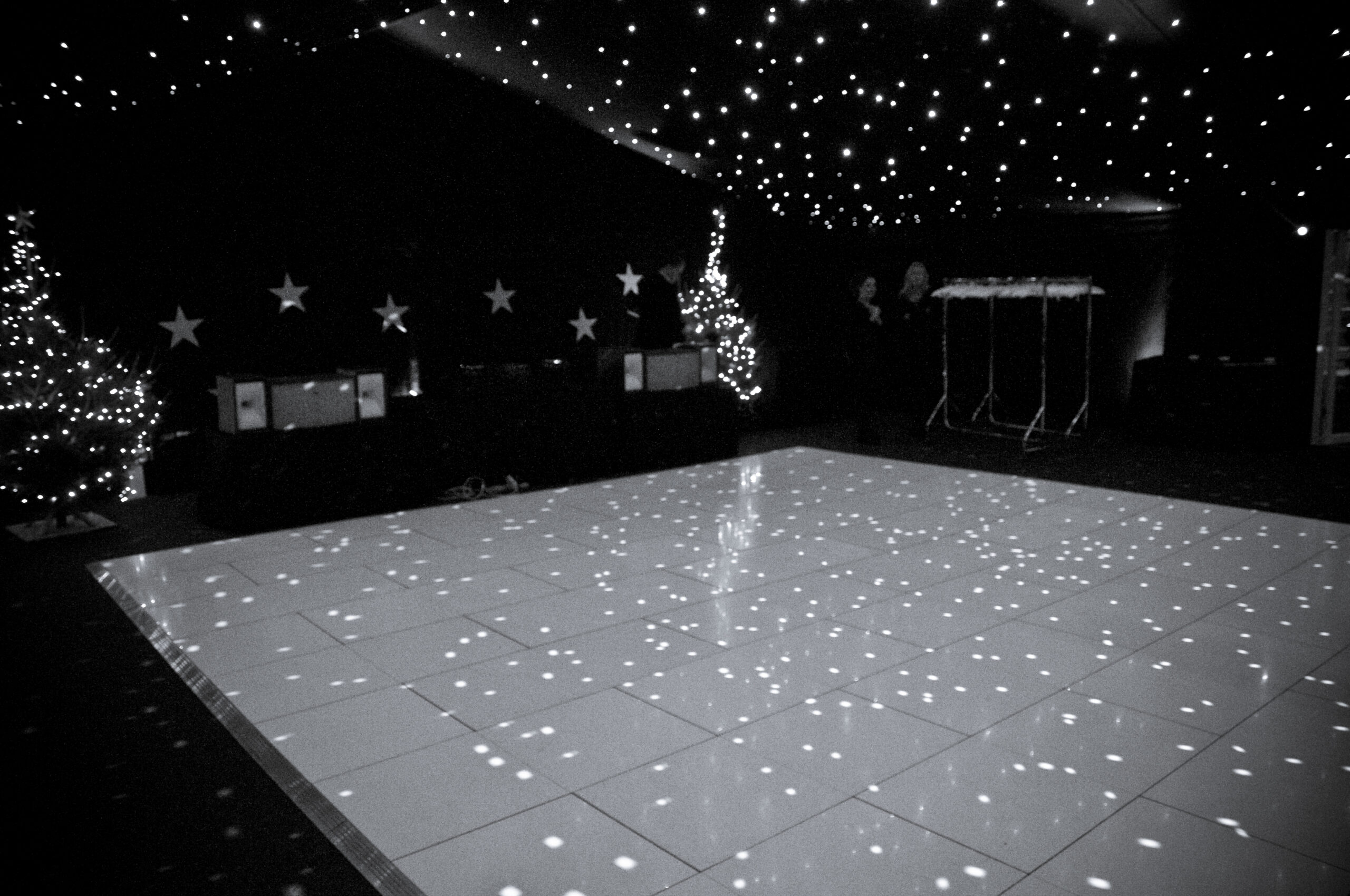 White acrylic dance floor & mirror ball reflection
