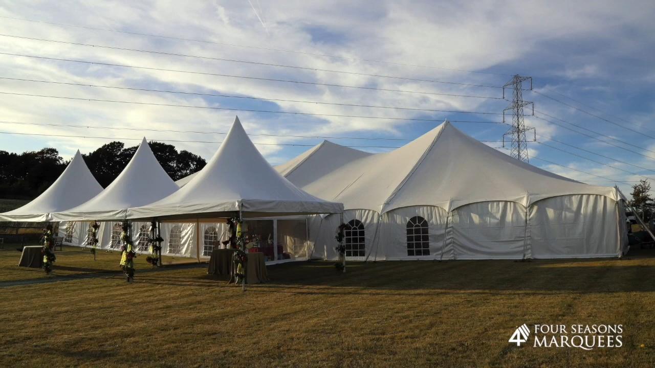 Large marquee with linked pagodas creating an elegant outdoor event space